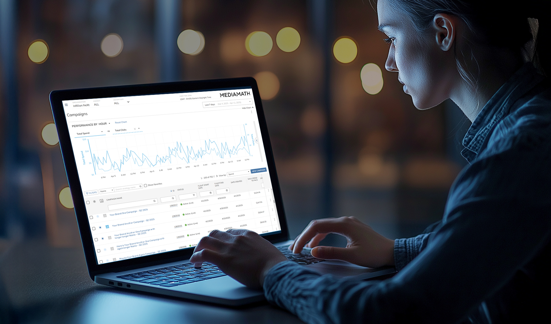 Woman using Infillion MediaMath on computer